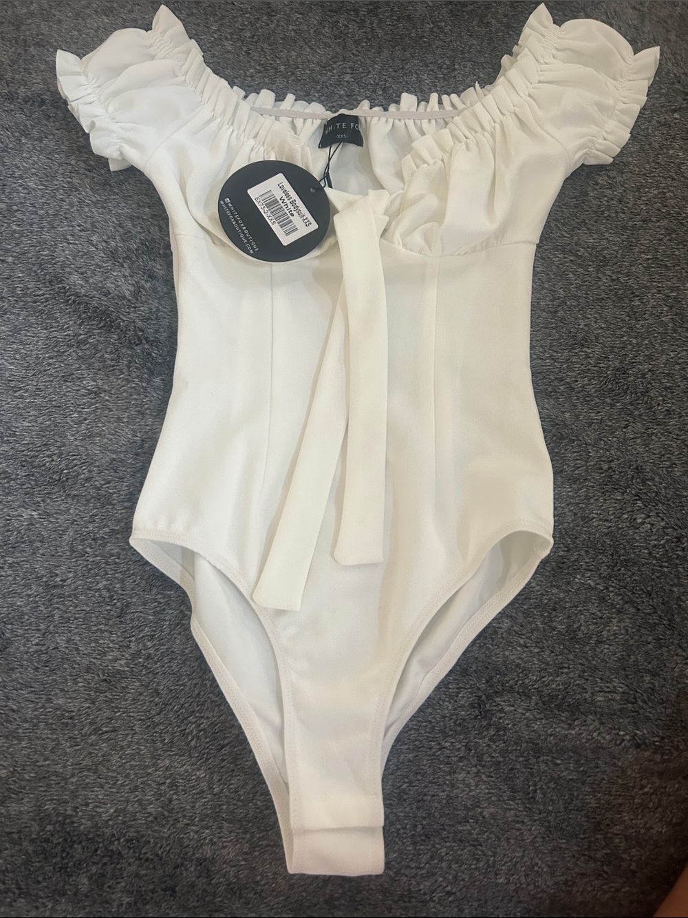 White Fox Boutique Off-Shoulder Ruffle One-Piece in White